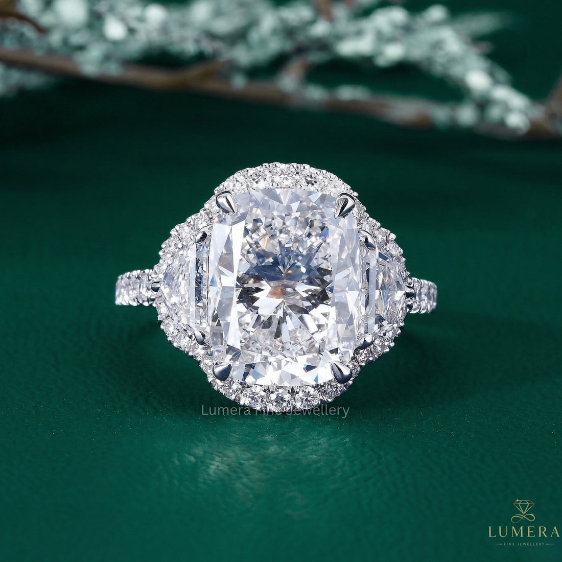 elongated cushion cut engagement ring with Cadillac side stones.