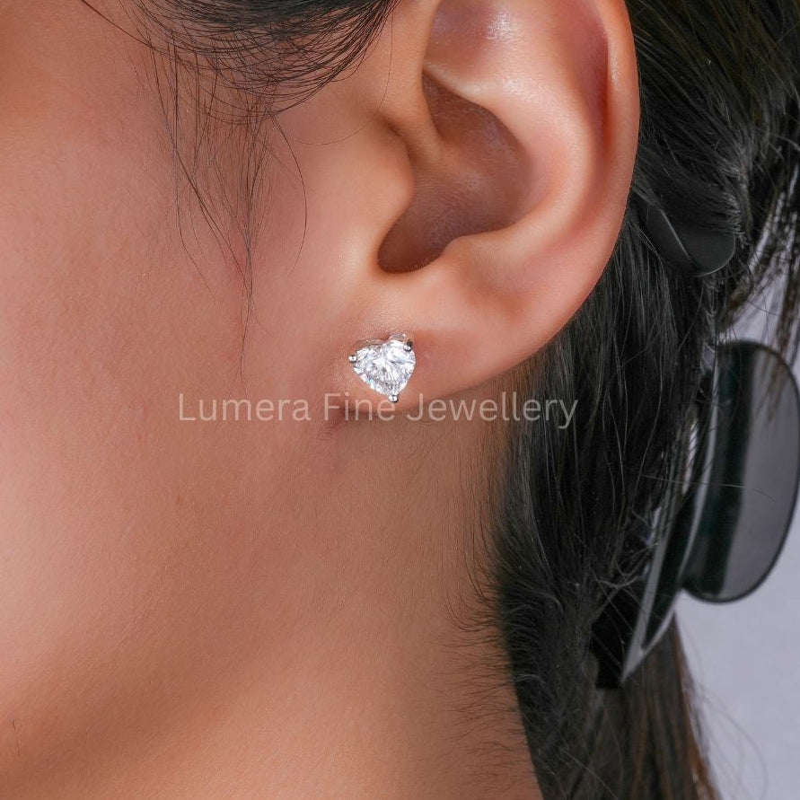 heart shape diamond earrings with solitaire earrings.
