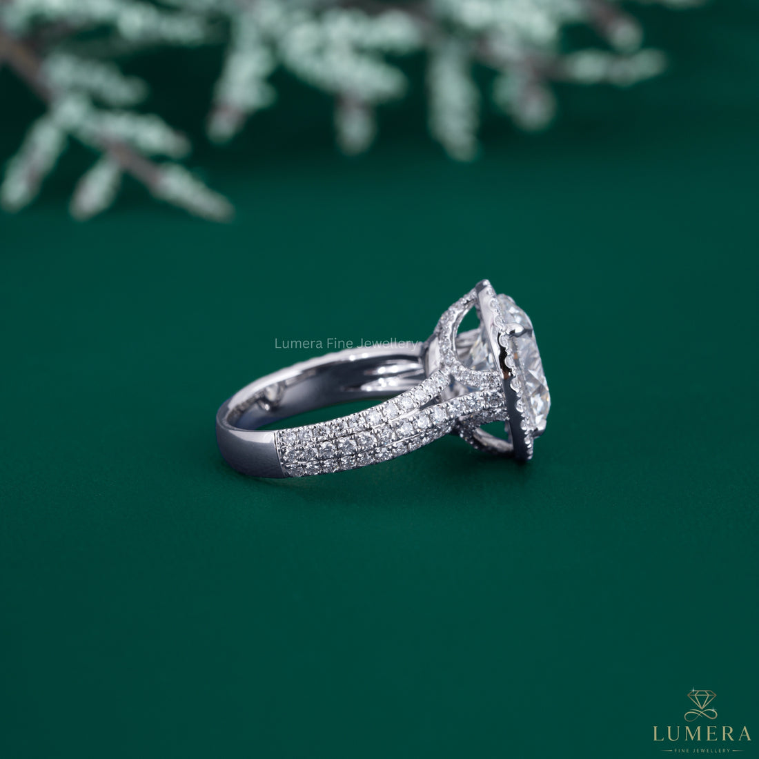 Halo diamond ring with claw prong setting.