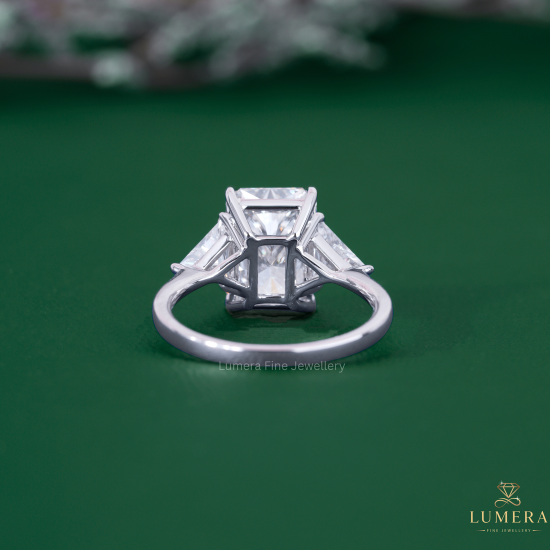 3 stone ring with trilliant cut diamond ring.