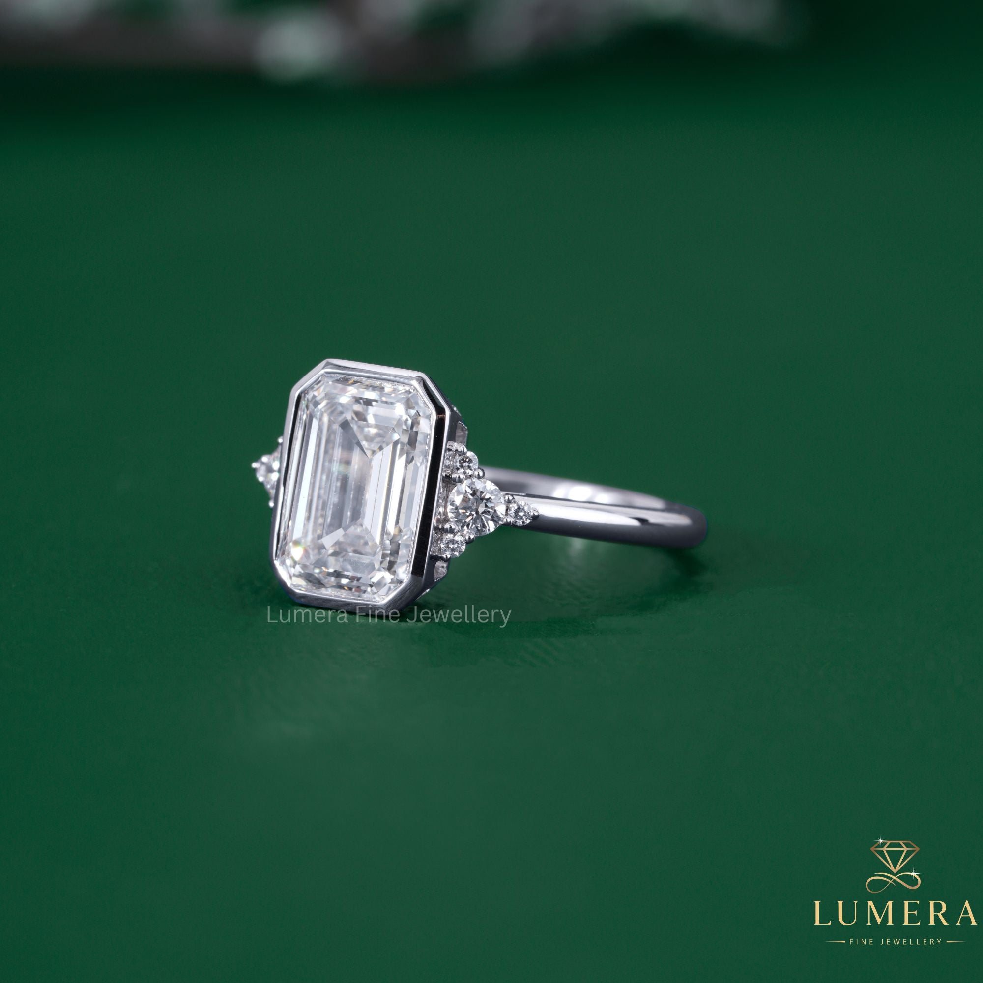 Emerald diamond ring with bezel engagement ring.
