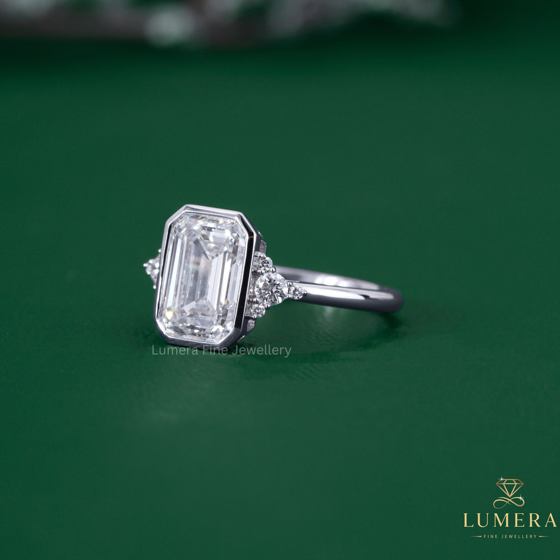 Emerald diamond ring with bezel engagement ring.
