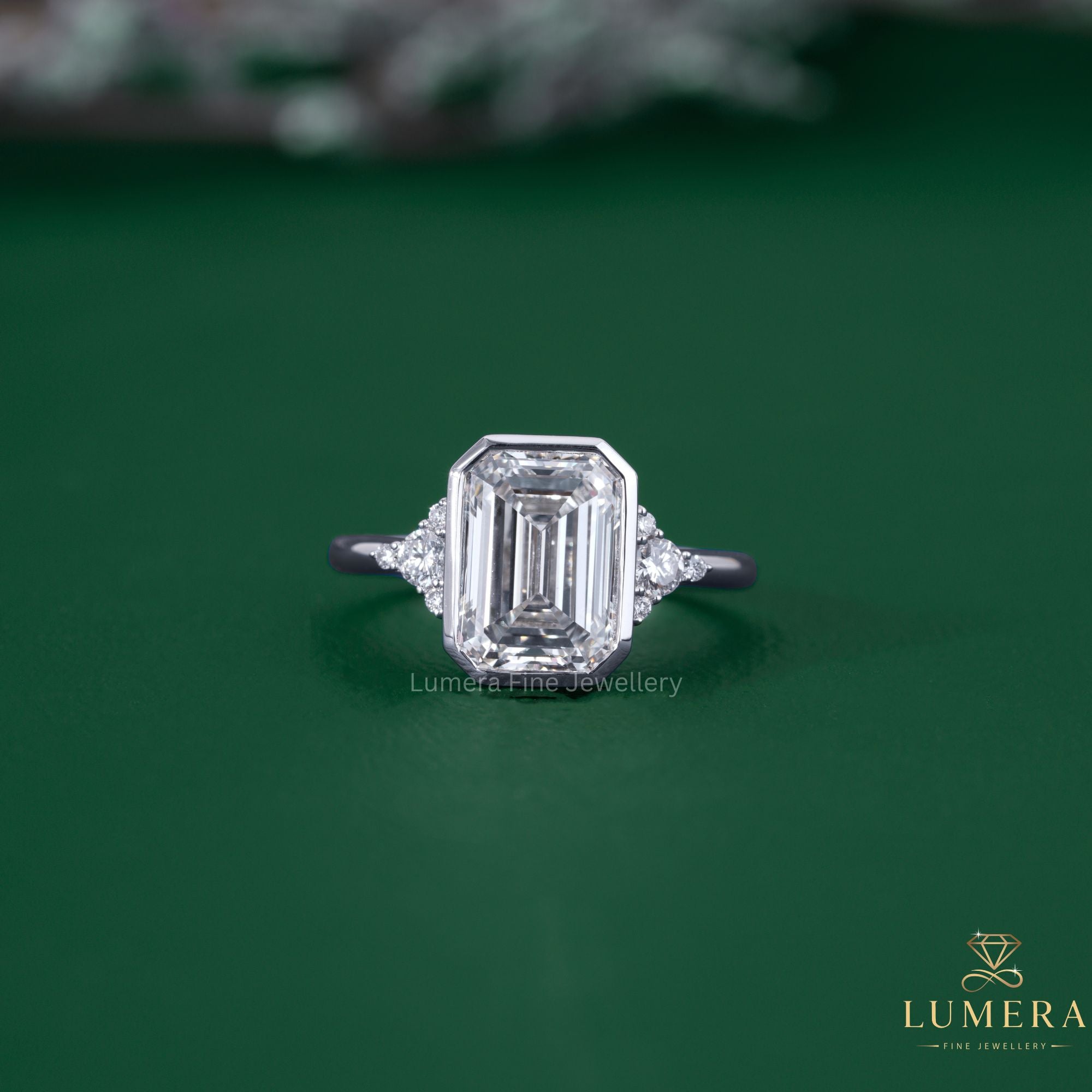 Bezel setting ring with emerald diamond ring.