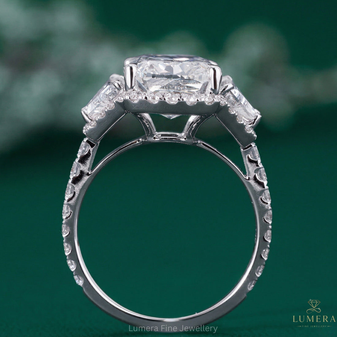 Cushion halo ring with three stone engagement ring.