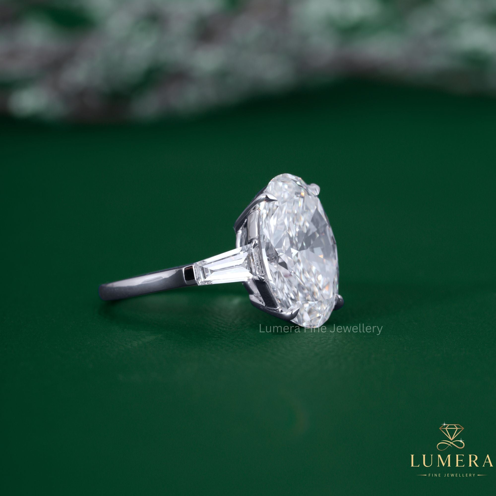 3 stone engagement ring with oval diamond engagement ring.