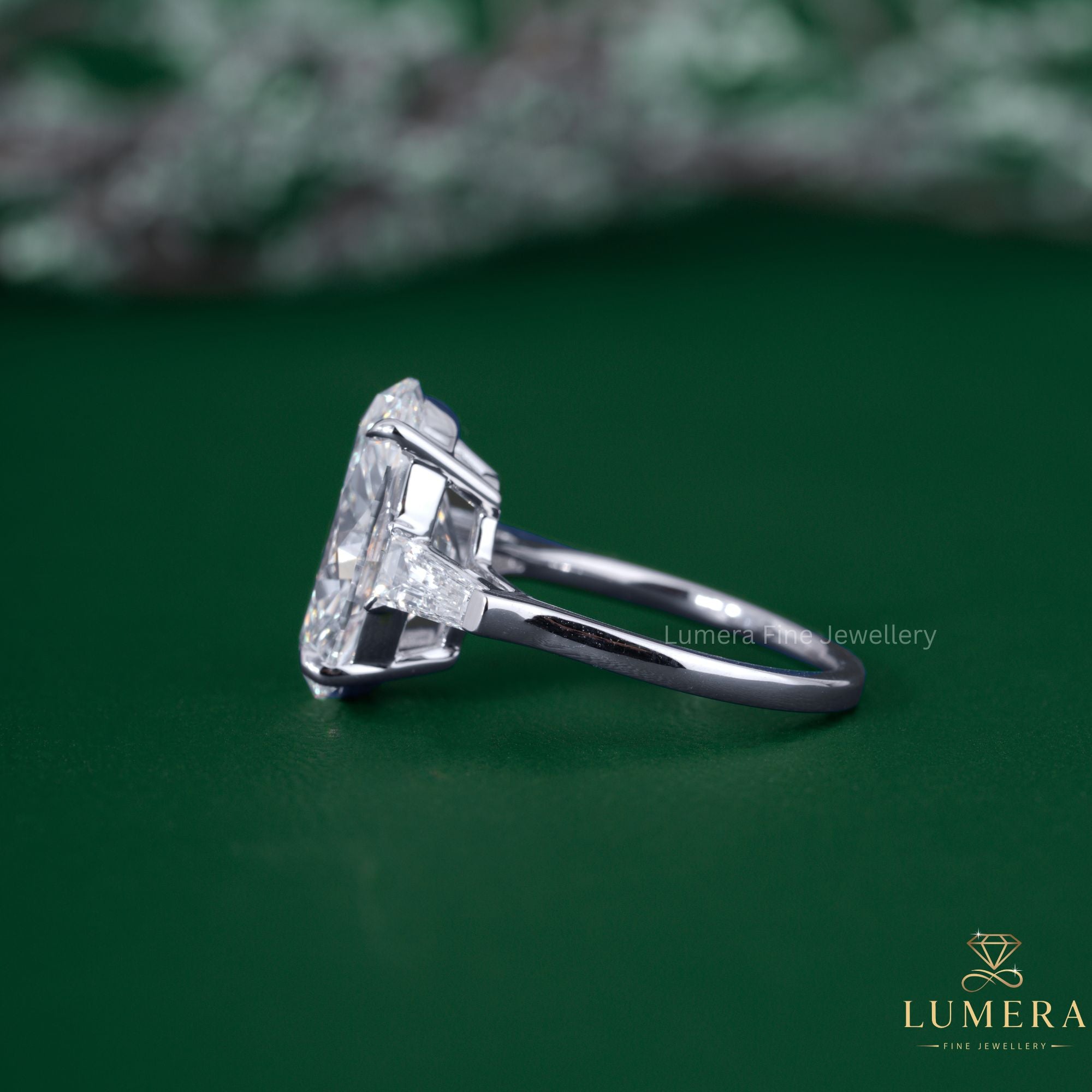 Oval and tapered baguette diamond ring with trilogy ring.