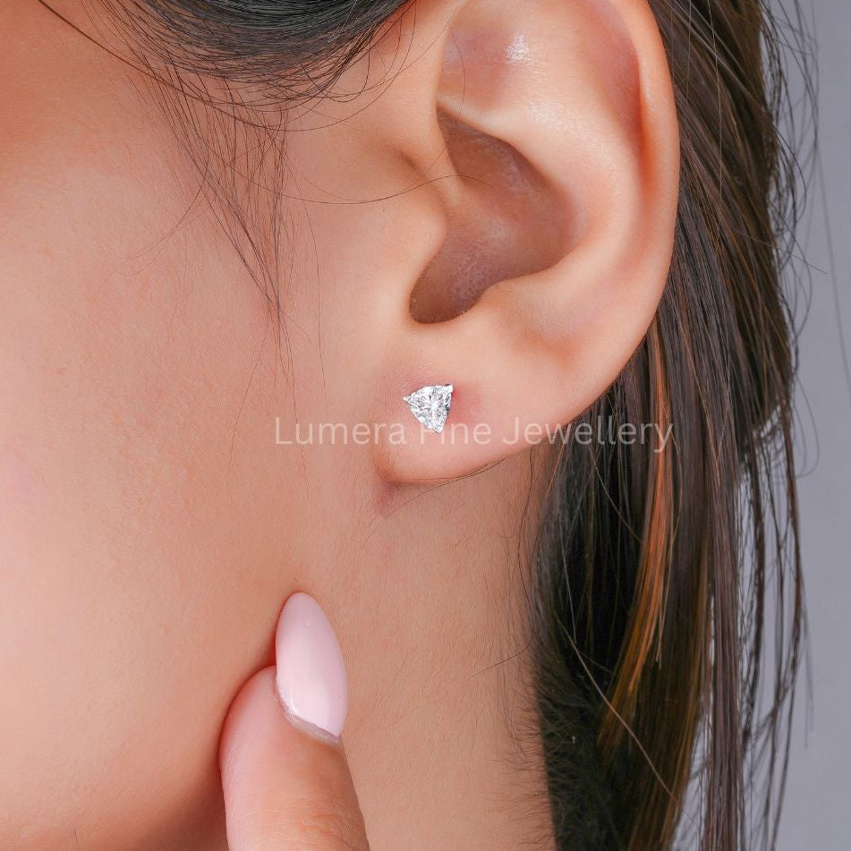 Trillion cut diamond earrings with solitaire earrings.
