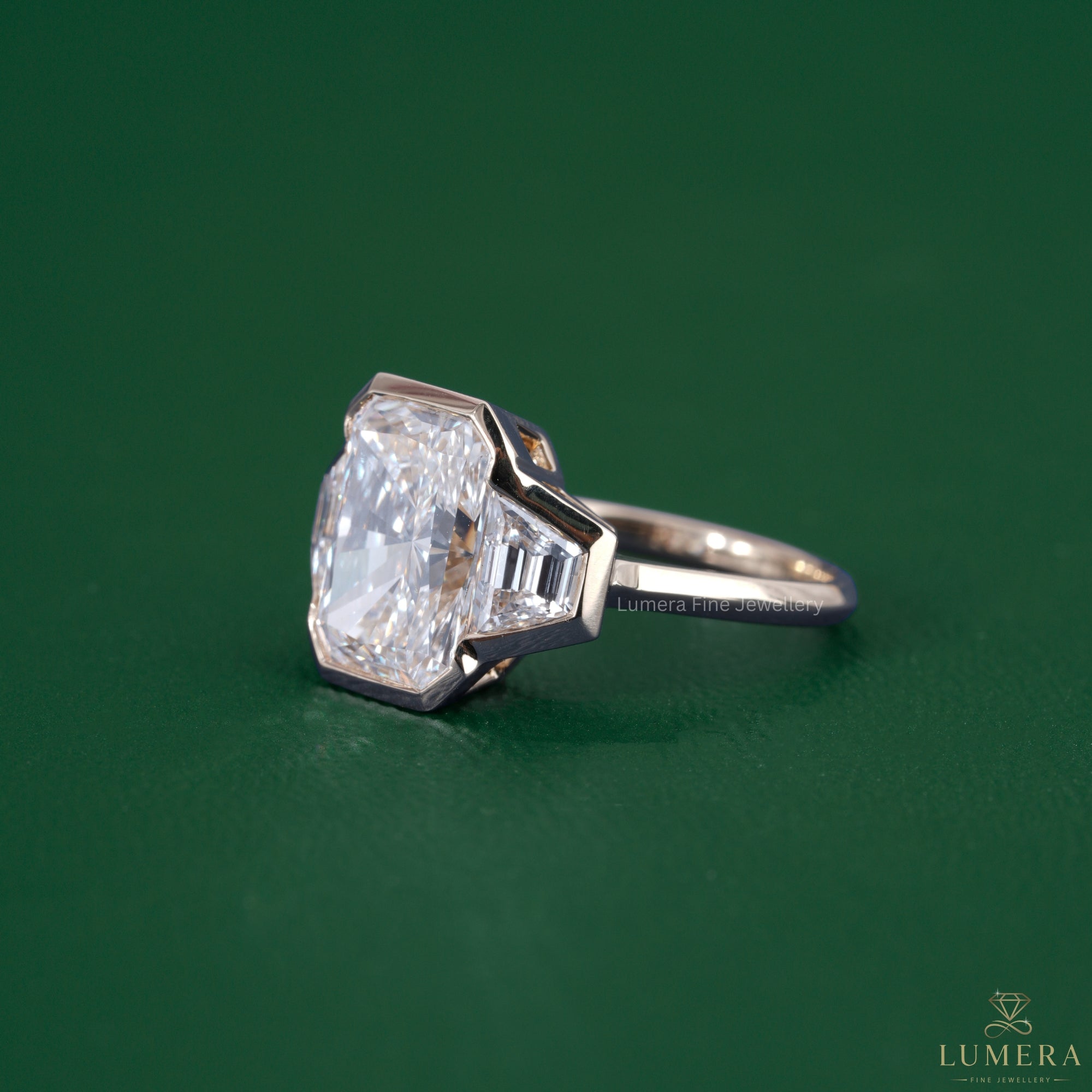 Radiant diamond engagement ring paired with a bezel setting ring.