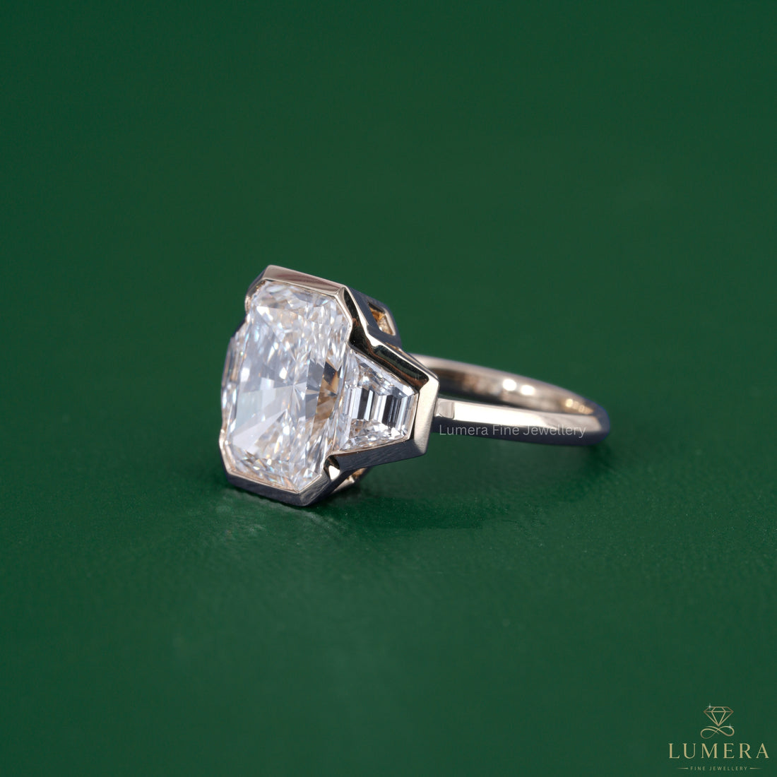 Radiant diamond engagement ring paired with a bezel setting ring.
