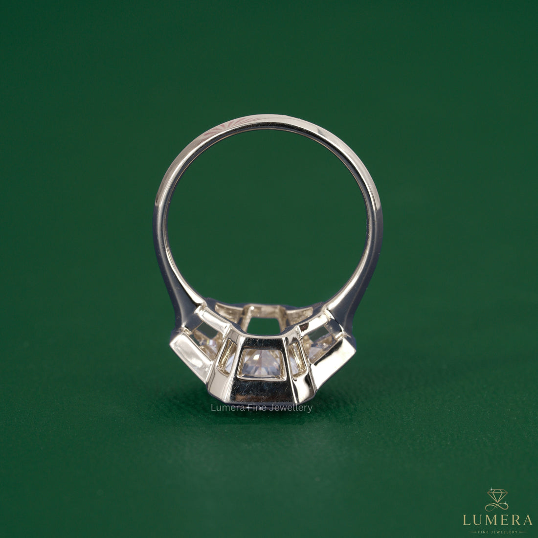 3 stone diamond ring featuring a trapezoid diamond ring.