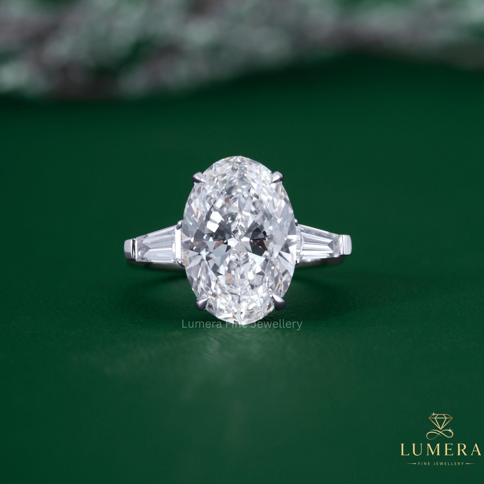 Three stone oval cut diamond engagement ring with three stone diamond ring.