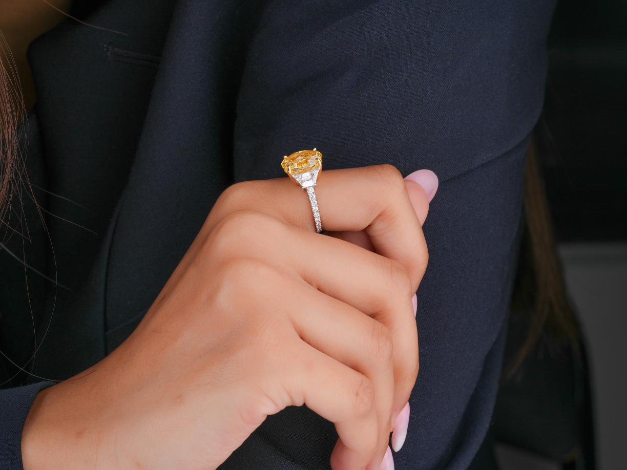 oval cut with trapezoid side stones with trillion engagement ring.

