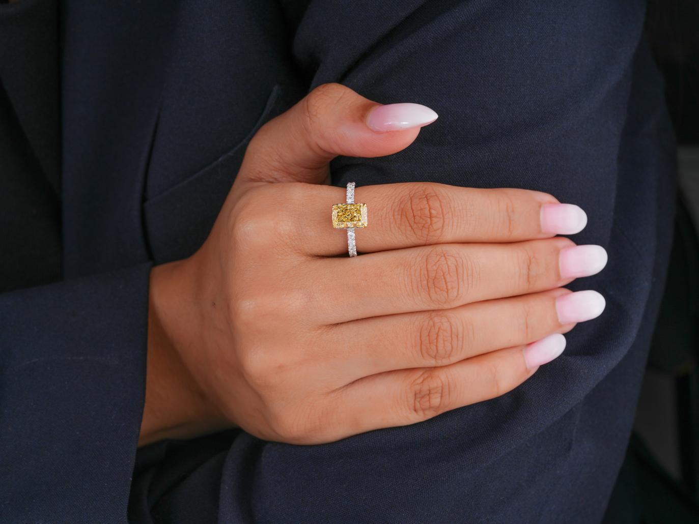 radiant yellow diamond ring with hidden halo diamond ring.
