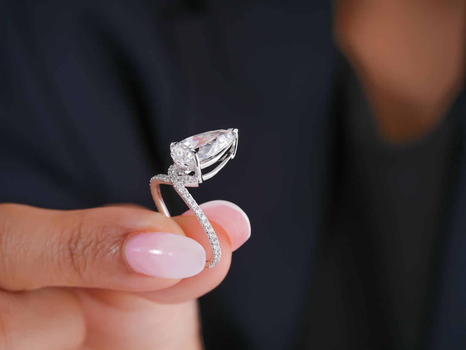 claw prong setting with almond shape diamond.

