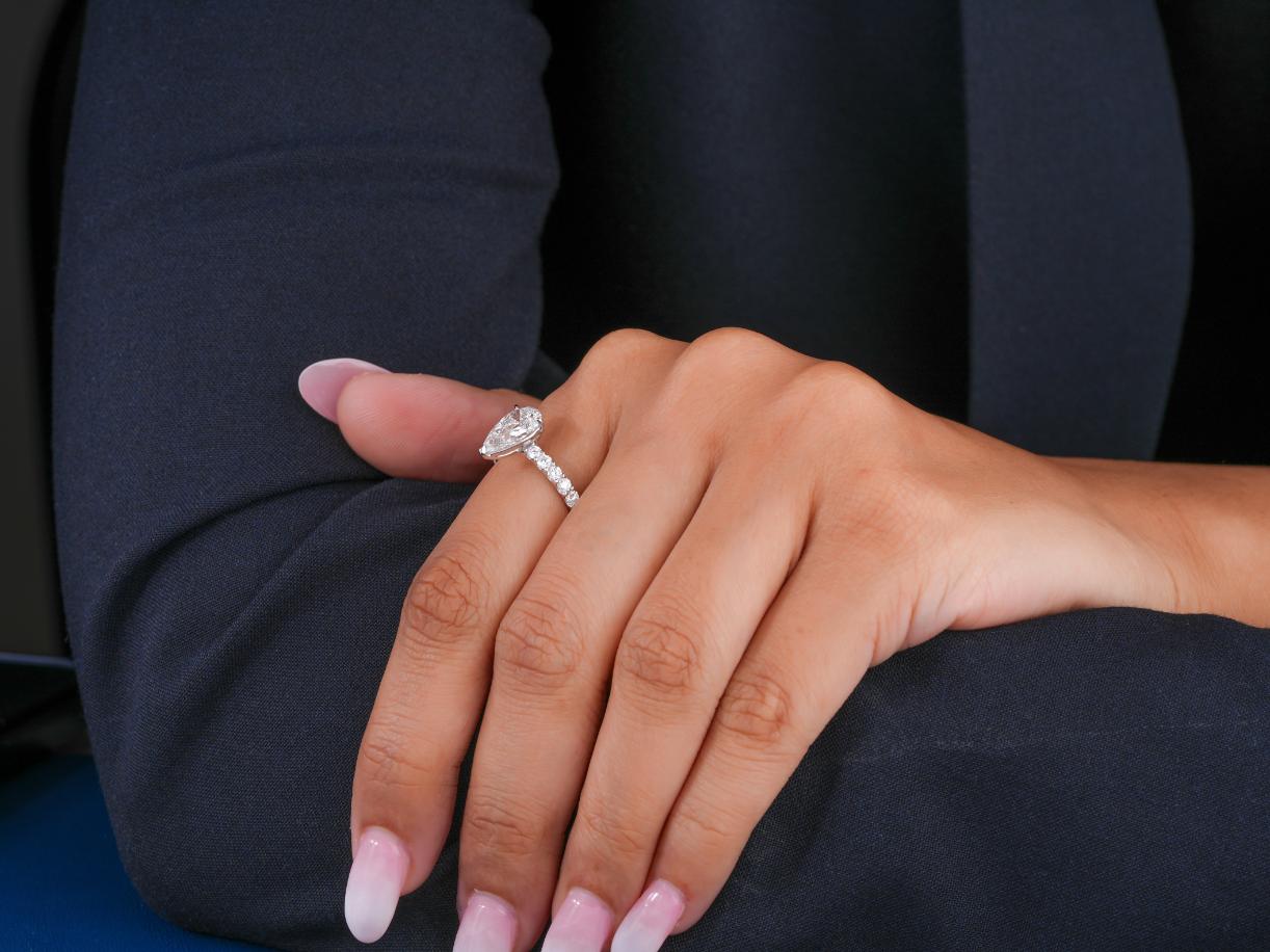 U prong setting with solid gold ring.
