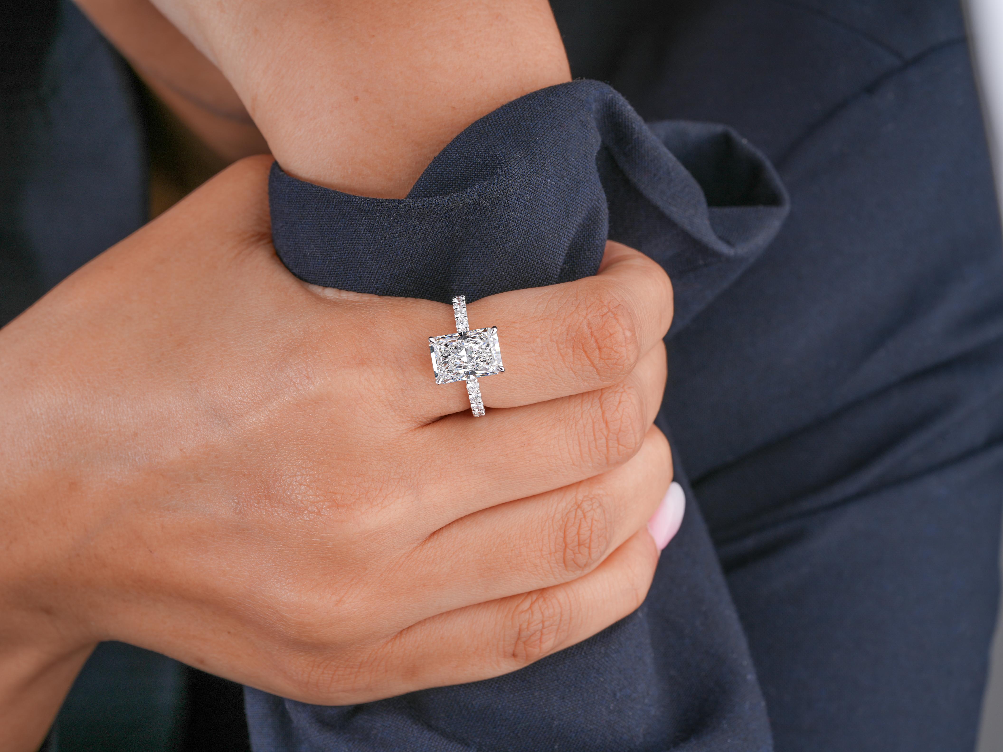 cushion cut diamond ring in pave setting band style.
