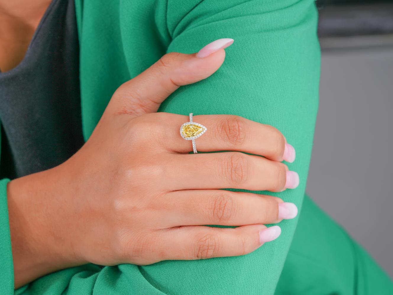 yellow pear diamond ring with two tone ring.
