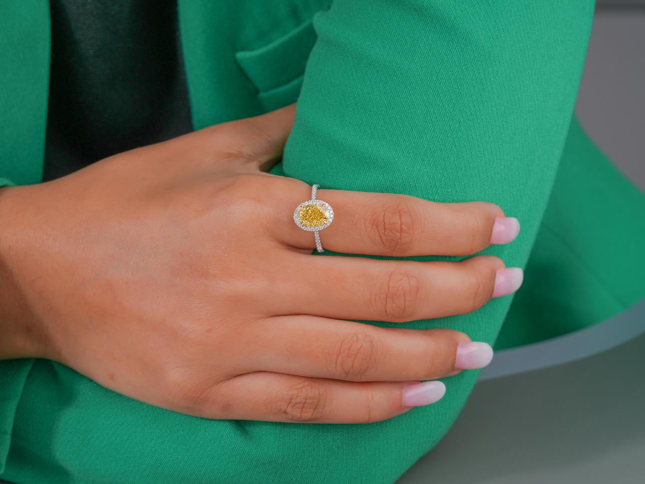 fancy yellow diamond engagement ring with cathedral set ring.
