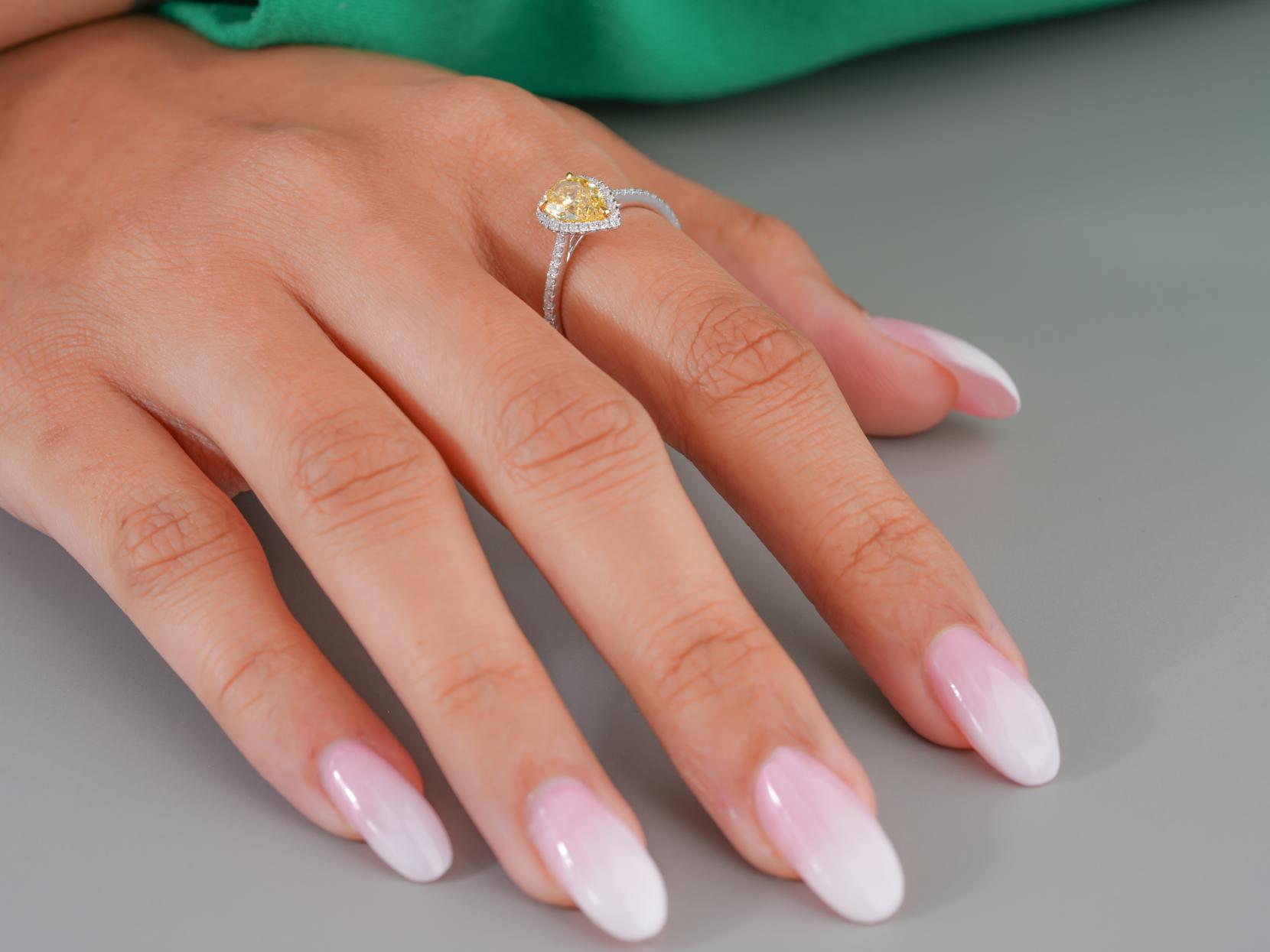 halo engagement ring with pear diamond pave ring.
