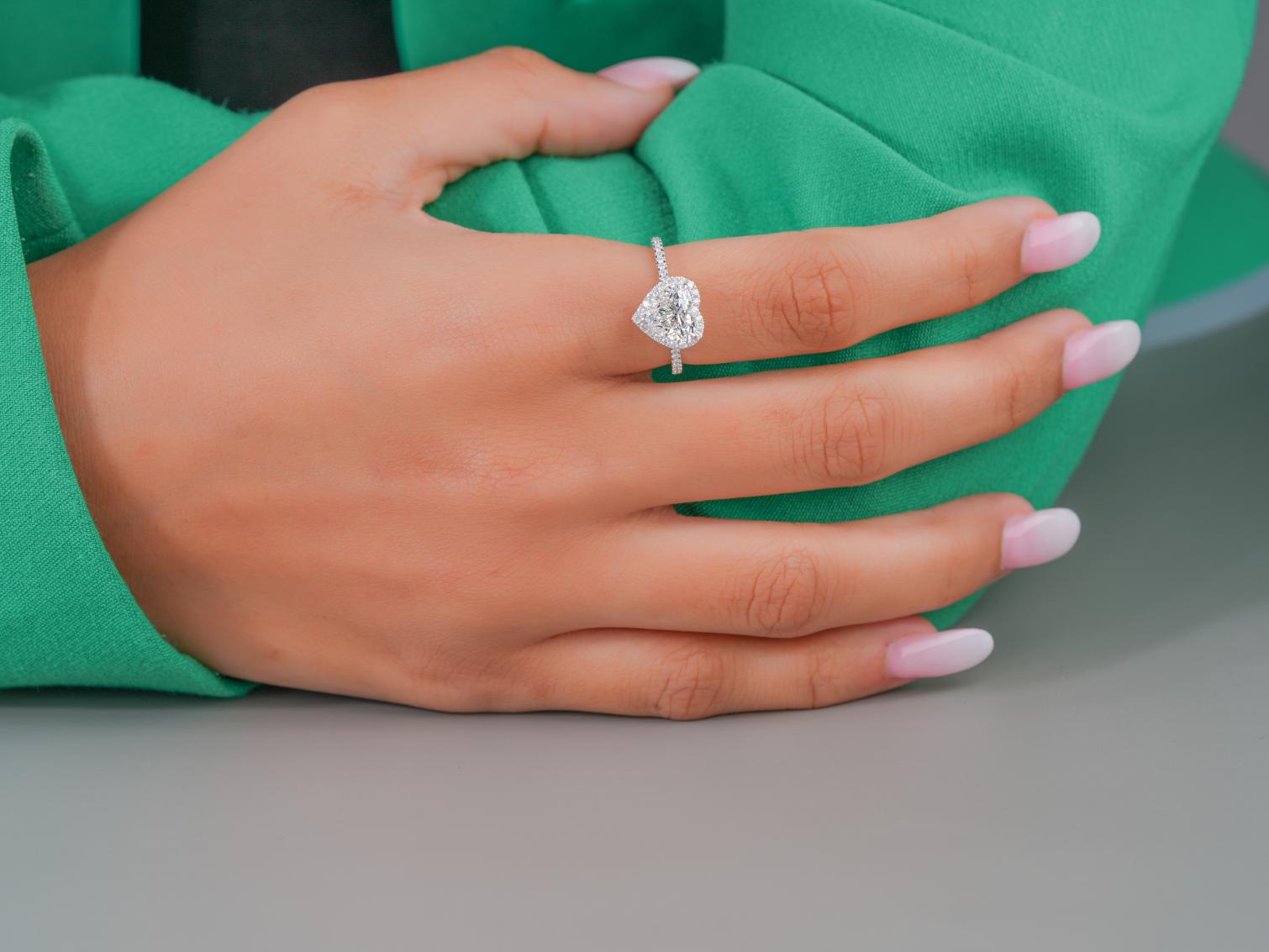 heart shape ring with claw and V prong setting.
