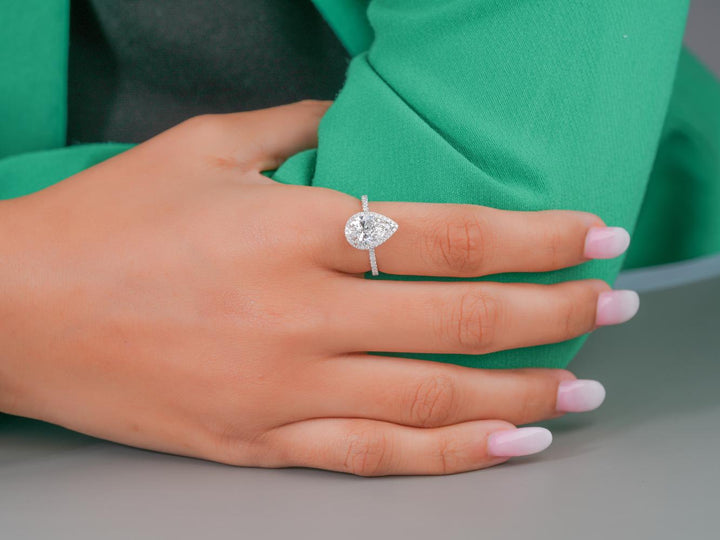 engagement ring pear with claw prong setting.
