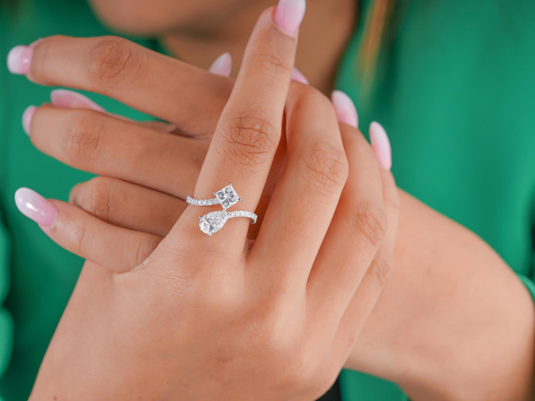 two stone diamond ring with pear and princess cut ring.
