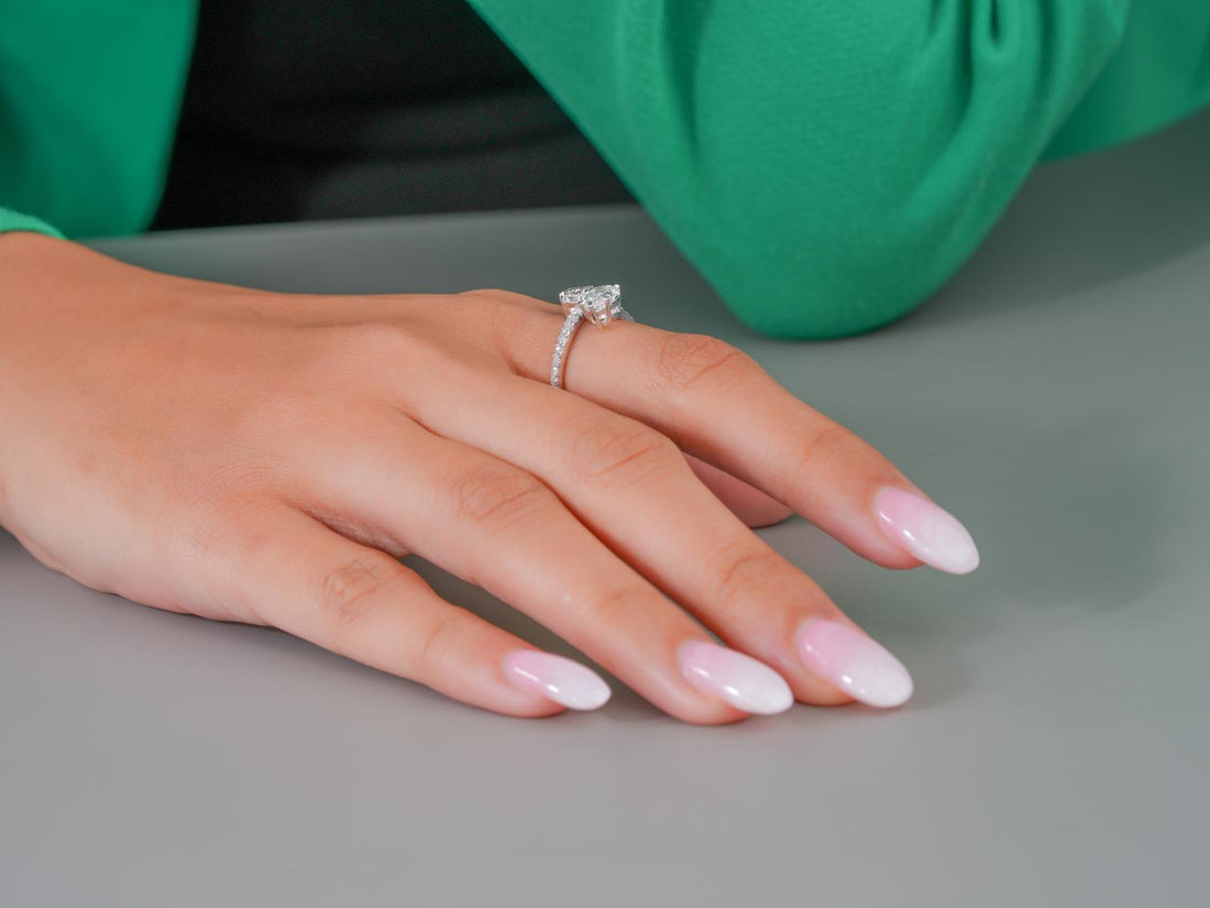 open band engagement ring with claw prong setting.
