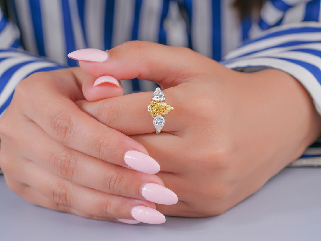 pear cut engagement ring in three stone ring style.
