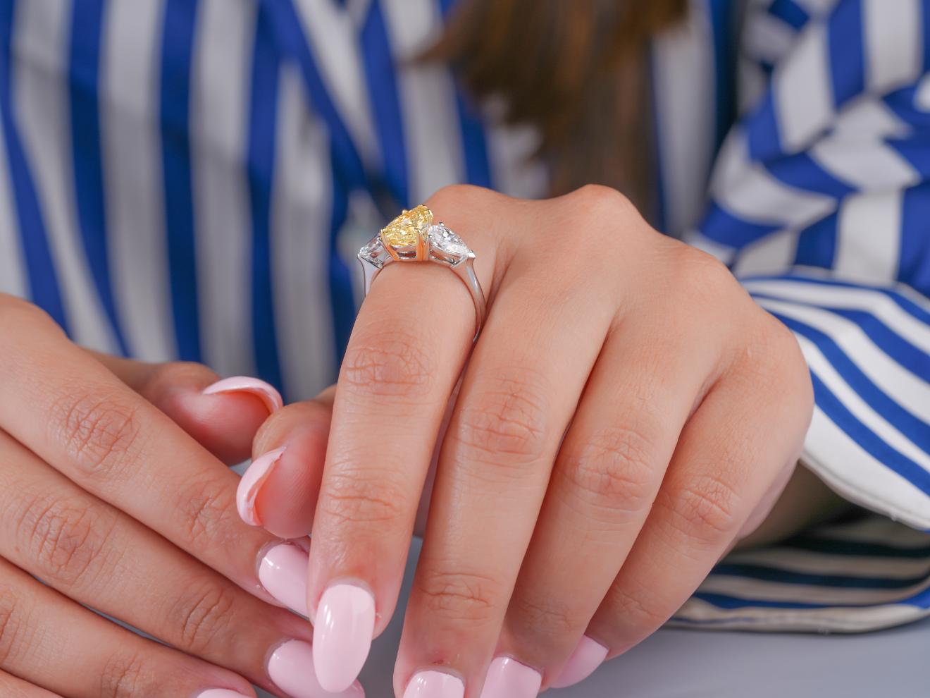 pear side stone on trilogy diamond ring.
