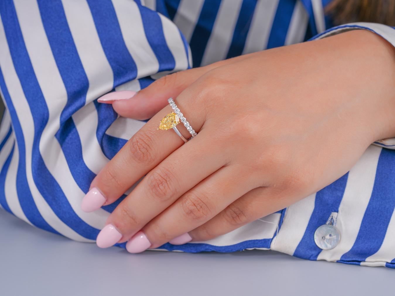 pear diamond ring in double row band ring style.
