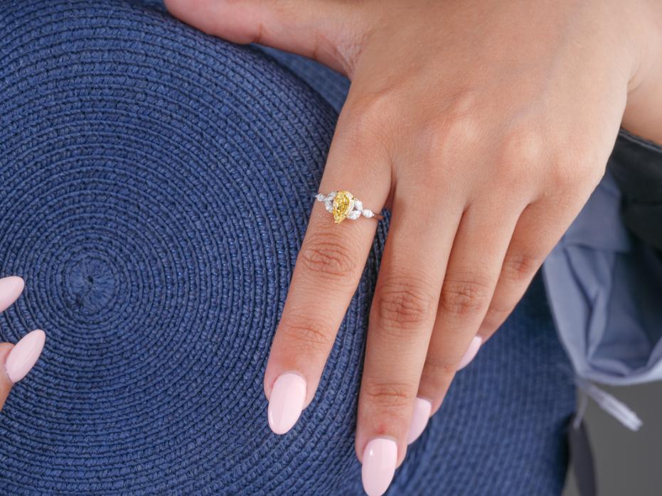 yellow pear diamond ring with muse setting.

