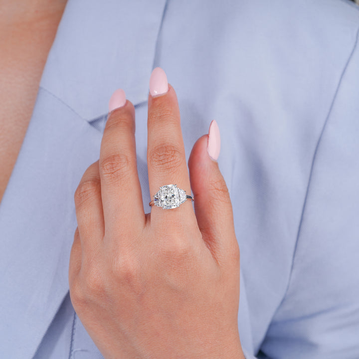 cushion engagement ring with three stone ring.

