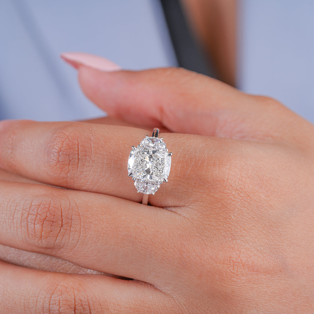 cushion cut diamond ring in trilogy diamond ring style.
