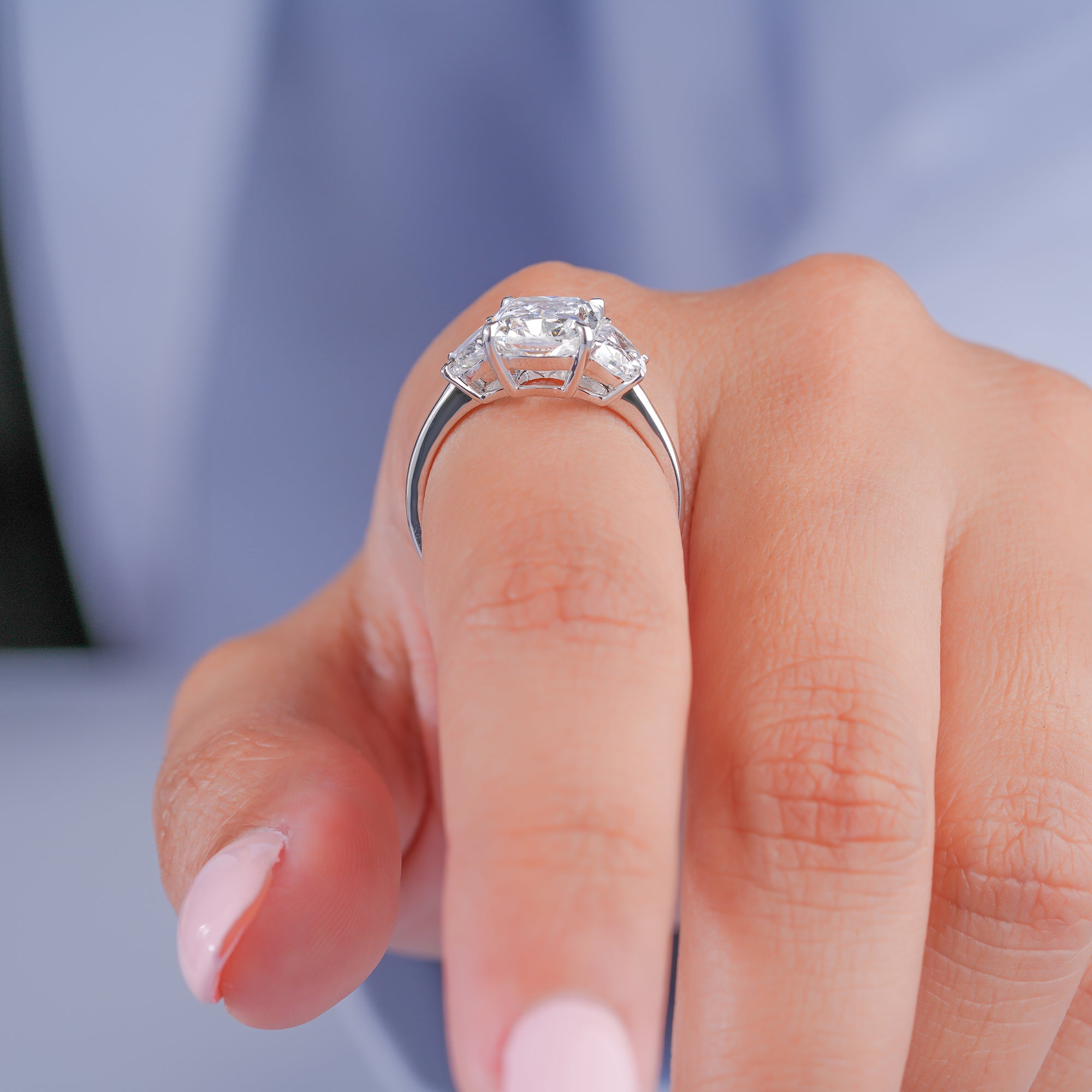 half moon cut side stone with past present future ring.
