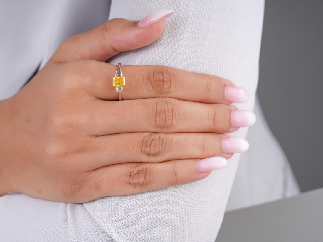yellow diamond ring with yellow radiant cut ring.
