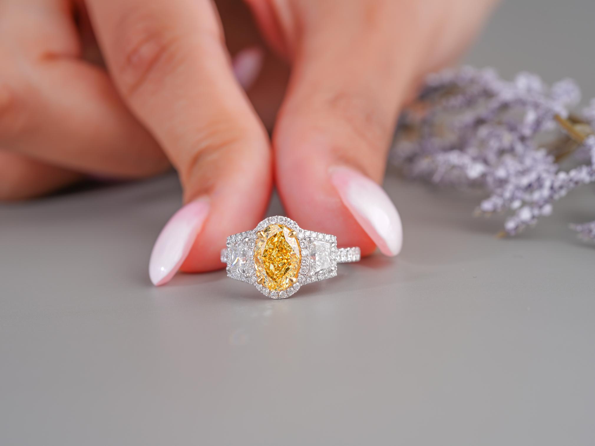oval diamond engagement ring in halo setting ring style.
