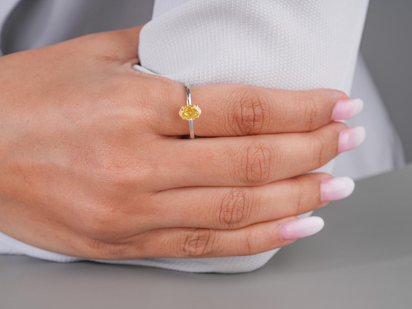three stone diamond ring in oval diamond ring style.