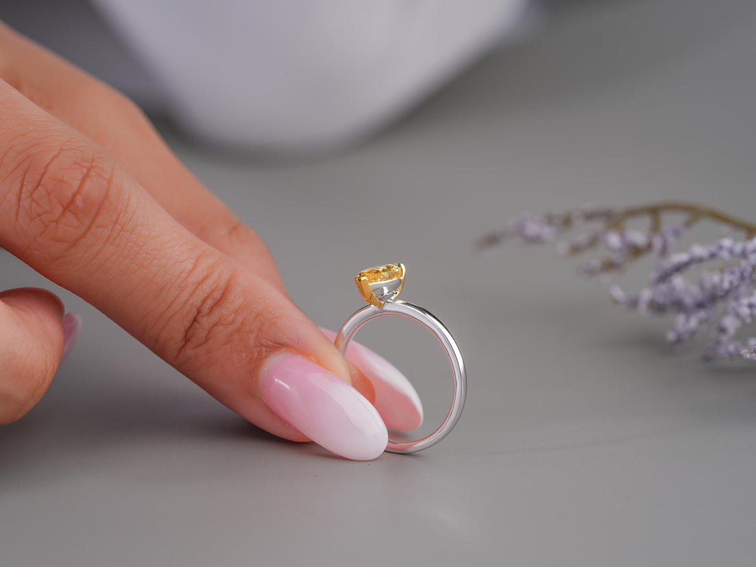 solitaire diamond engagement ring on minimal ring.
