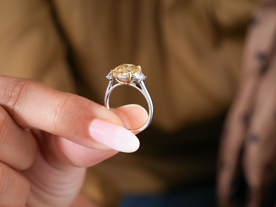 yellow cushion diamond ring with yellow gold prong.
