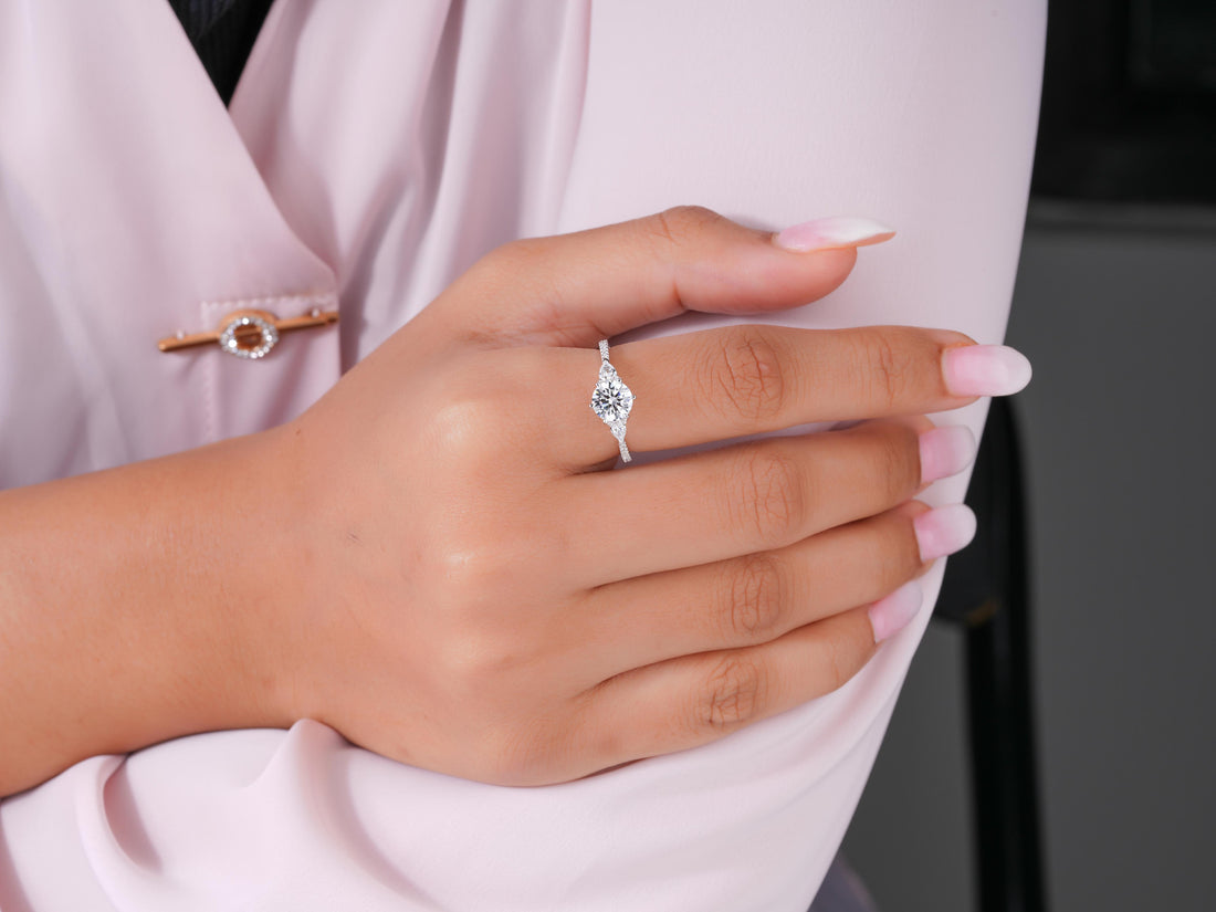 round diamond ring with two pear side stone.
