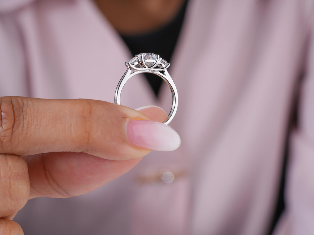 round cut engagement ring with cathedral setting.
