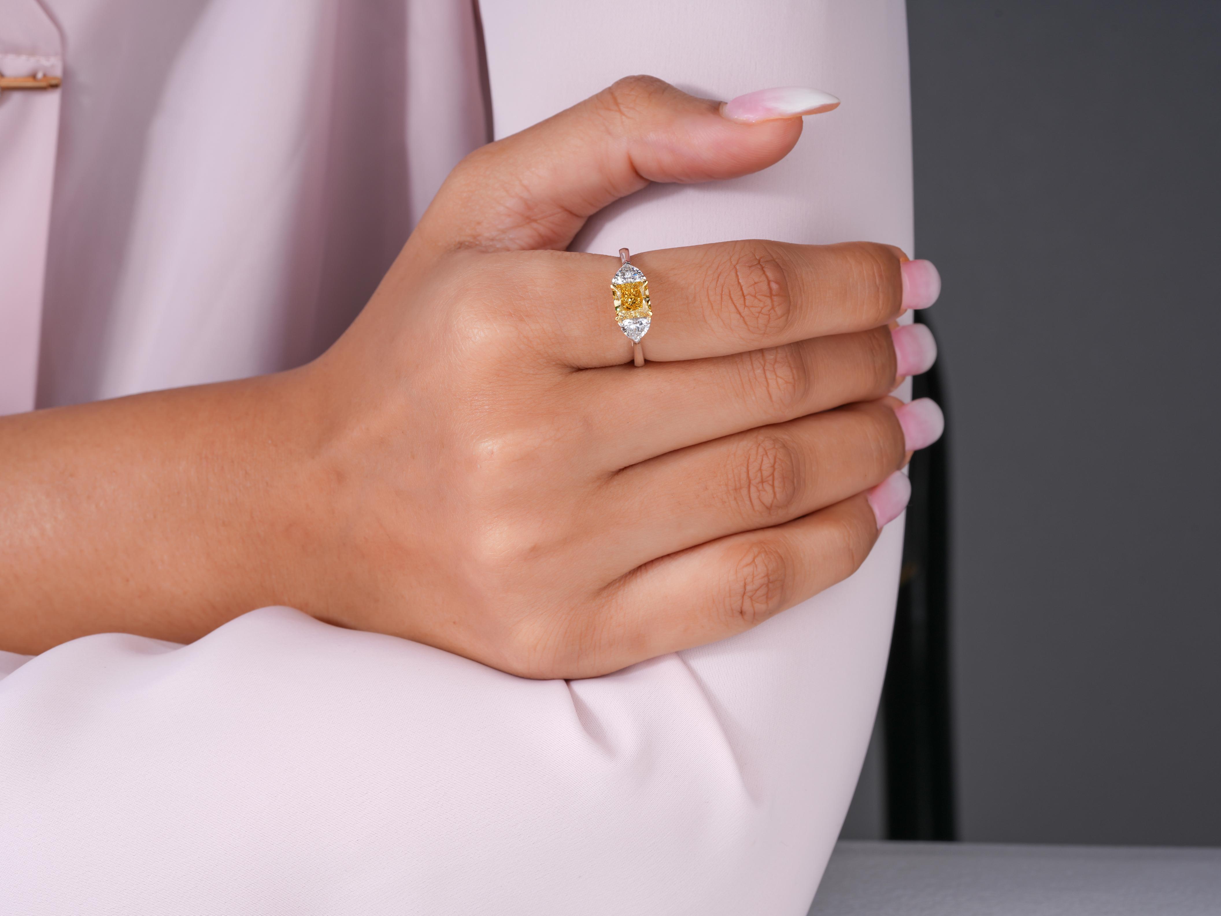 three stone ring with 4 claw prong set.
