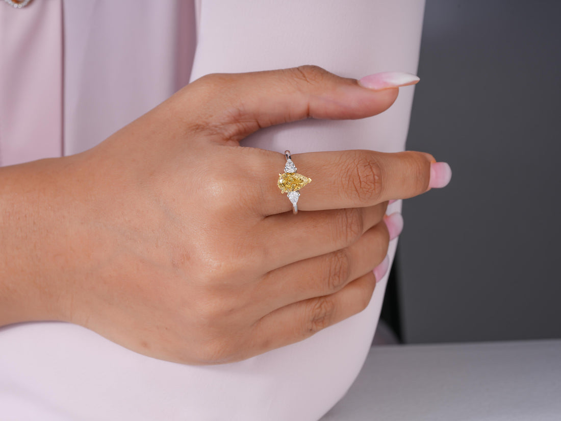 yellow pear diamond ring in pear shaped ring style.
