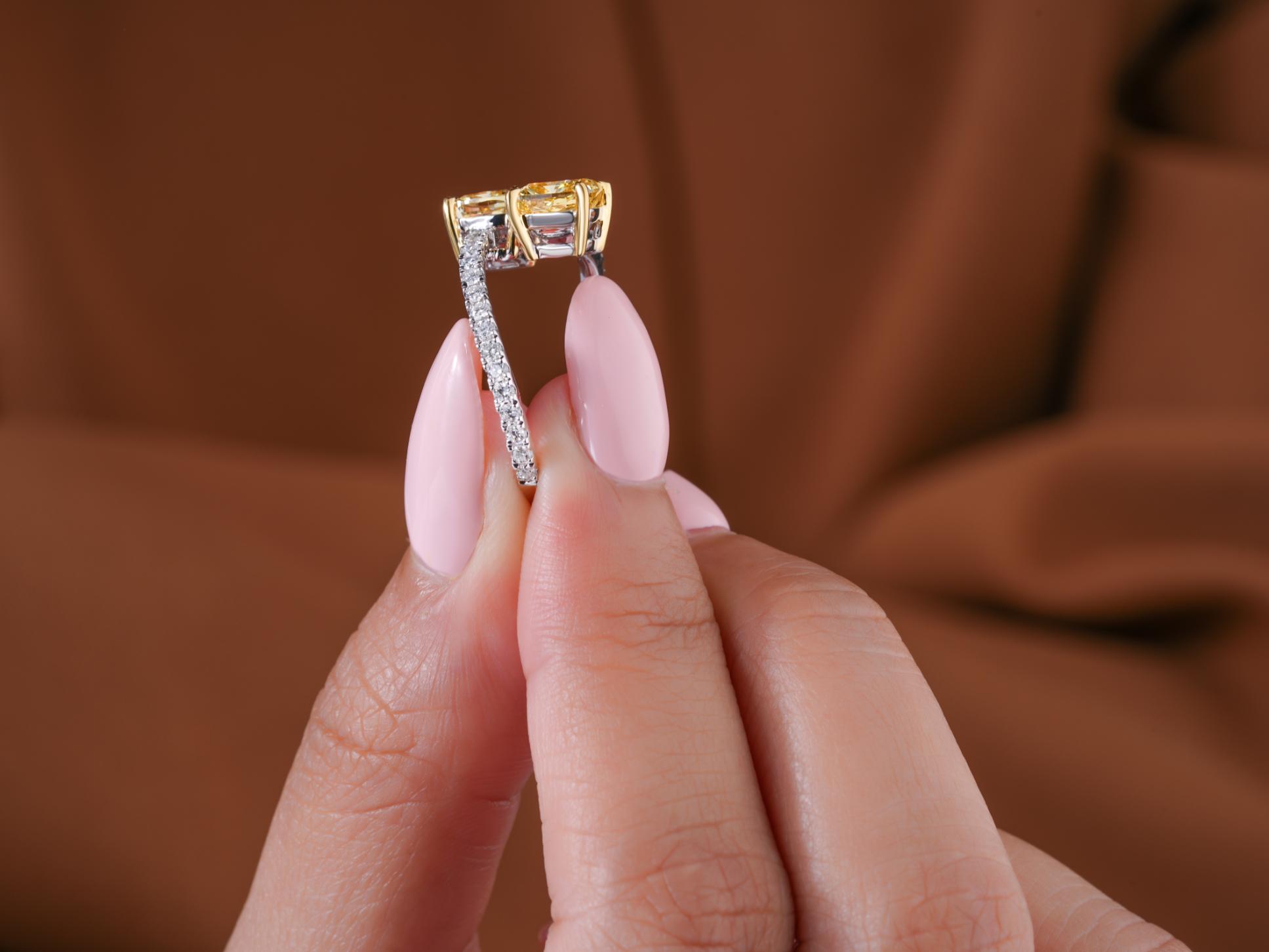 yellow cushion diamond ring with two tone gold ring.
