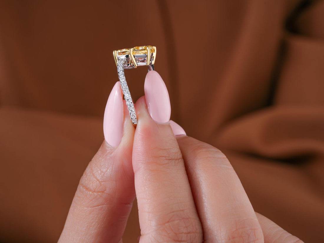 yellow cushion diamond ring with two tone gold ring.
