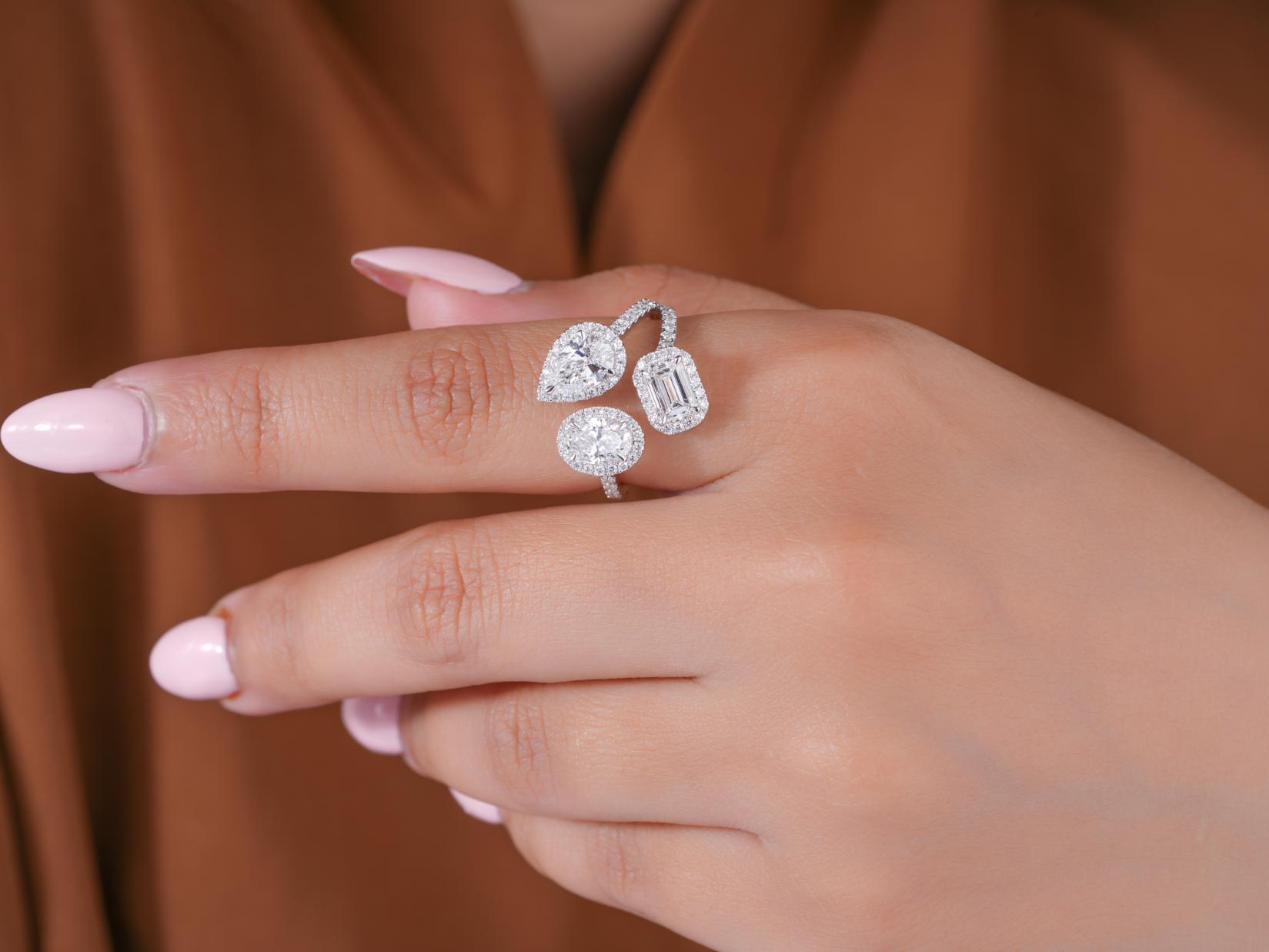 pear shaped engagement ring with oval diamond engagement ring.
