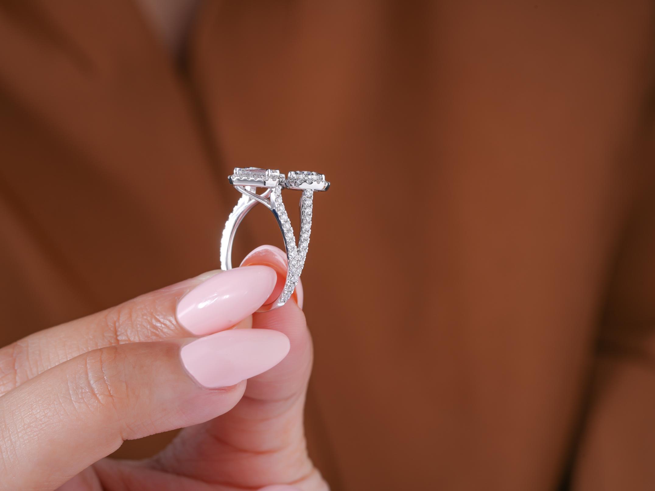 emerald diamond engagement ring with oval diamond ring.
