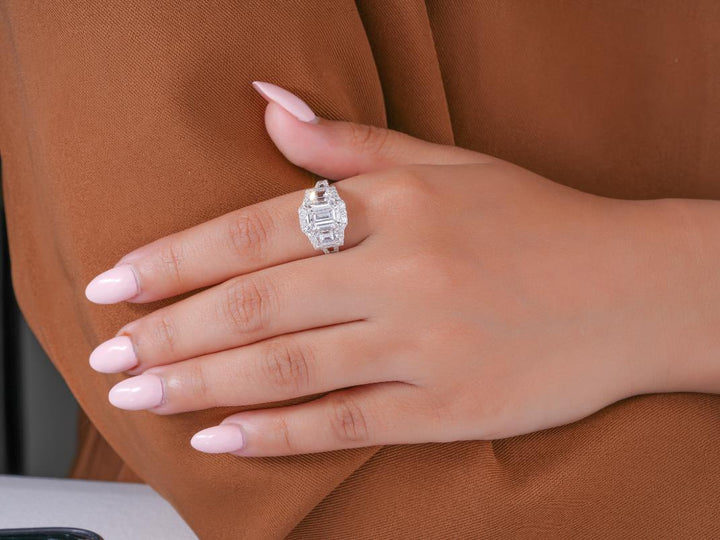 three stone diamond ring in trapezoid side stone style.
