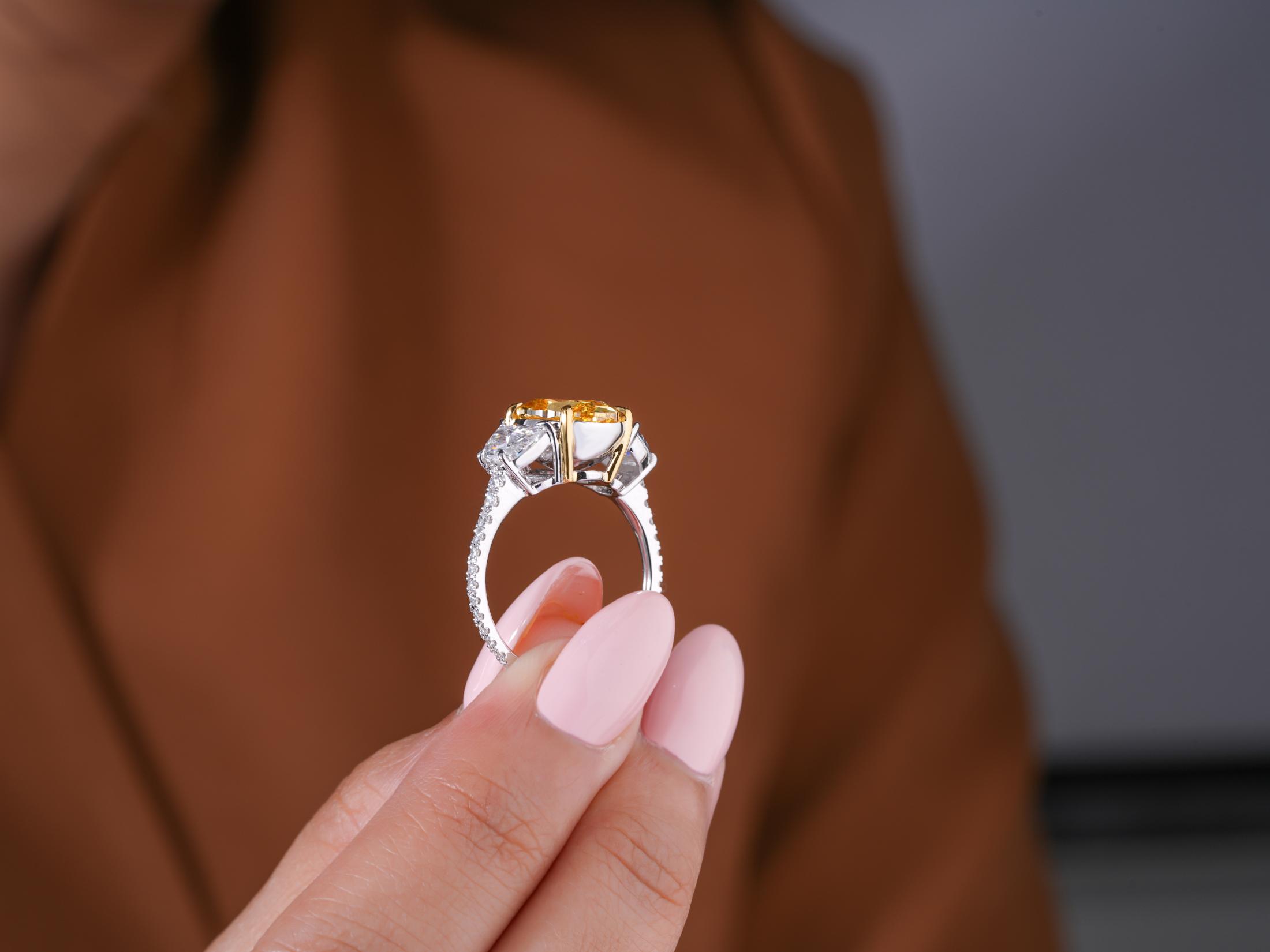 4 claw prong setting on solid gold ring.
