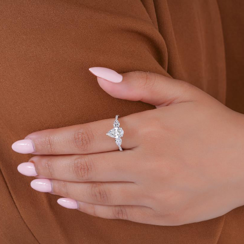 Pear diamond three stone ring with Pear side stones.
